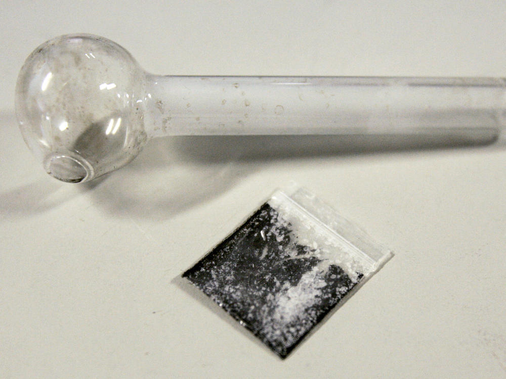 A pouch containing crystalized methamphetamine and a homemade pipe.