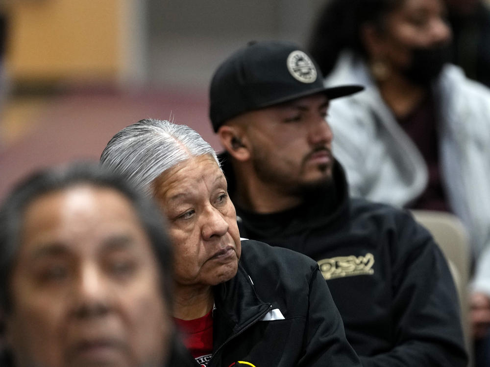 Residents of Gila River Indian Community listen during a 