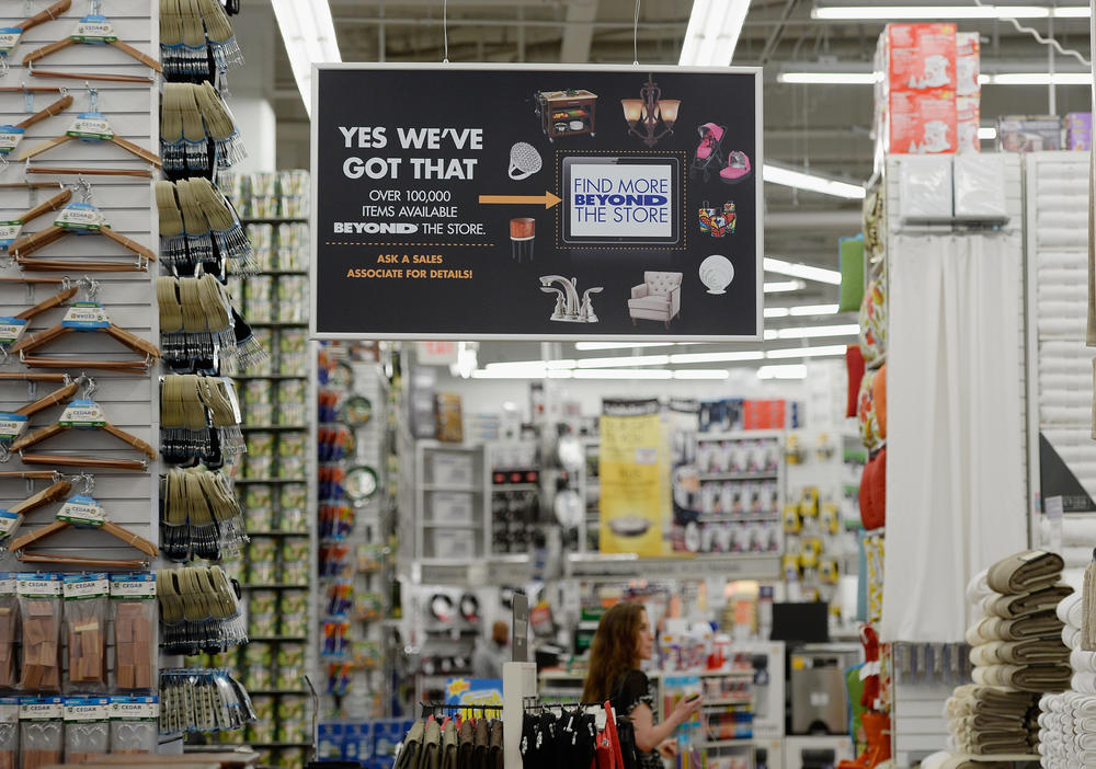 A sign advertises jewelry, furniture and appliances at Bed Bath & Beyond in Los Angeles in 2013.