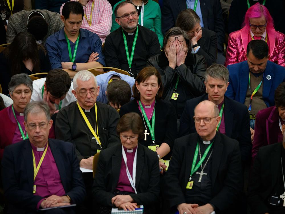 Members of the Church of England General Synod pray ahead of a vote that ultimately approved blessings for same-sex couples in London on Thursday.