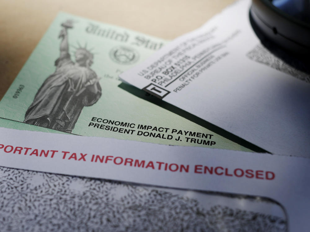 In this file photo from April 23, 2020, former President Donald Trump's name is seen on a stimulus check issued by the IRS to help combat the adverse economic effects of the COVID-19 outbreak. The IRS announced Friday, Feb. 10, 2023, that most relief checks issued by states last year aren't subject to federal taxes, providing 11th hour guidance as tax returns start to pour in.