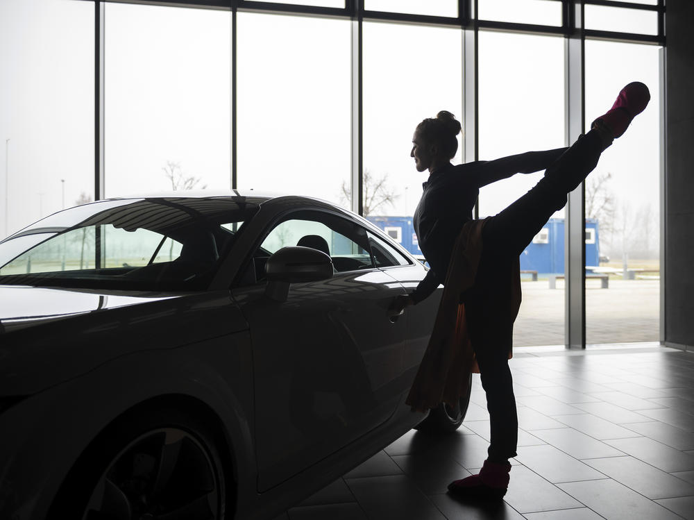 A ballet dancer warms up before an open rehearsal at the Audi automobile factory in Gyor, Hungary, on Thursday. The Ballet Company of Gyor is rehearsing at the factory after being forced to shutter its rehearsal hall in response to soaring energy prices.