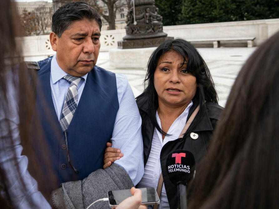 Jose Hernandez and Beatriz Gonzalez, stepfather and mother of Nohemi Gonzalez, who died in a terrorist attack in Paris in 2015, talk Tuesday to reporters outside the U.S. Supreme Court following oral arguments in Gonzalez v. Google.