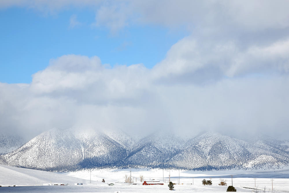 Snow covered peaks are viewed after a series of atmospheric river storms brought heavy snowfall to the region on January 22, 2023 near Mammoth Lakes, California.