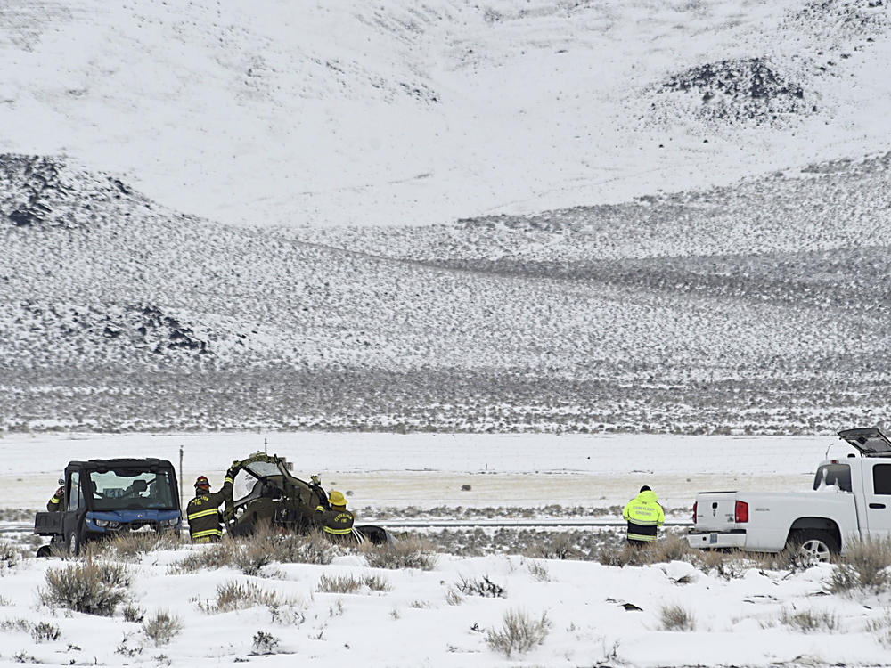 A Care Flight medical transport plane carrying a patient and four others that crashed the day before is seen Saturday, Feb. 25, 2023, in Lyon County, Nev. All five people on board were killed.