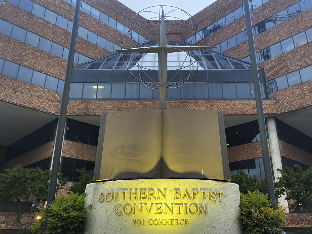 A cross and Bible sculpture stand outside the Southern Baptist Convention headquarters in Nashville, Tenn., in 2022.