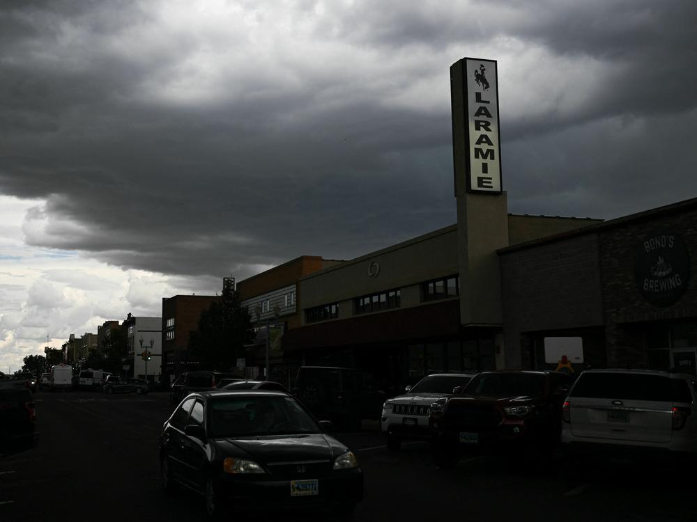 Serial's new true-crime podcast, <em>The Coldest Case in</em> Laramie, revisits a 1985 murder<em>. </em>Above, storm clouds over downtown Laramie, Wyo., on Aug. 13, 2022.