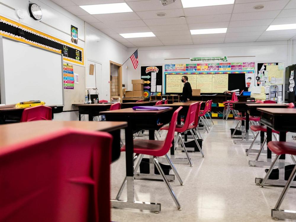 A Louisville, Ky., classroom sits empty in January 2022, during a COVID surge driven by the omicron variant. Students lost the routine of going to school during the pandemic, and now many are struggling to get back in the habit.