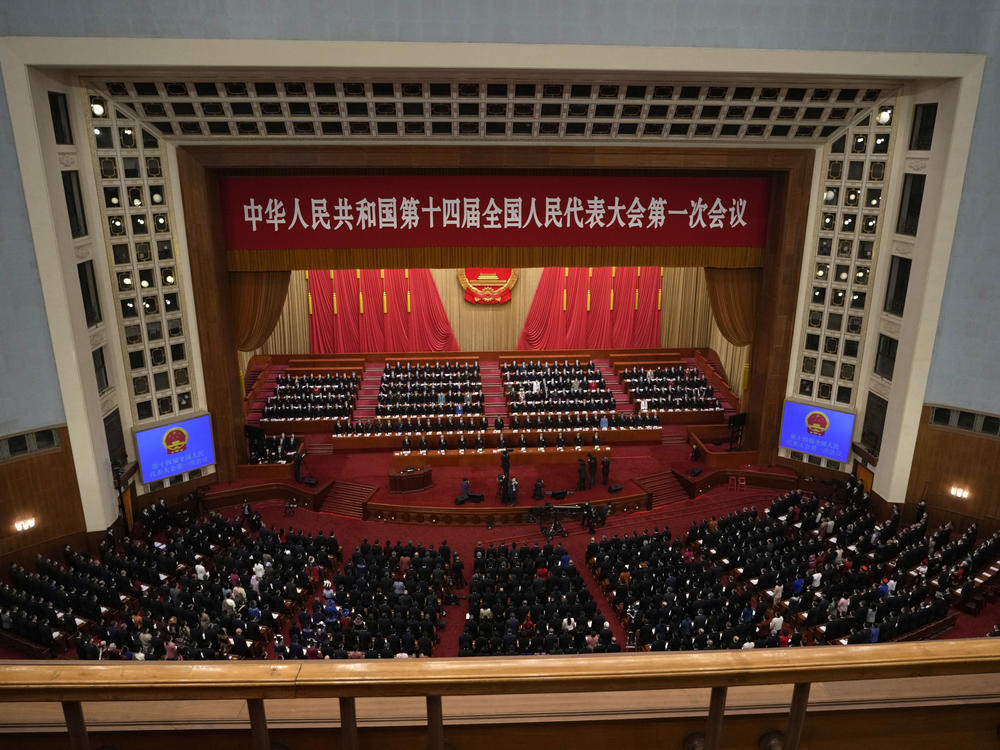 Delegates attend the opening session of China's National People's Congress (NPC) at the Great Hall of the People in Beijing, Sunday, March 5, 2023.