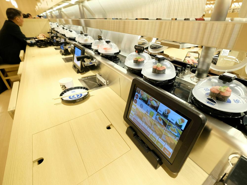 The global flagship store for Kura Sushi, a Japanese conveyor-belt sushi restaurant chain, is pictured here in January 2020 in Tokyo. Conveyor-belt sushi restaurants have been the target of a spate of pranks.