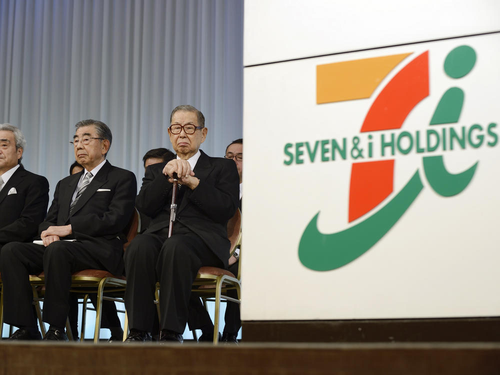 Seven & I Holdings Co. founder and honorary chairman Masatoshi Ito, right, attends the company's initiation ceremony for new employees in Tokyo, Japan, on March 13, 2014.