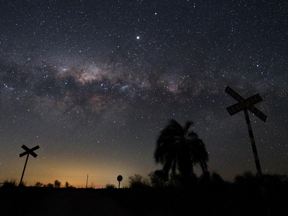 The Milky Way's Galactic Center and Jupiter (brightest spot at center top) are seen from near Reboledo, department of Florida, Uruguay, early on August 24, 2020.
