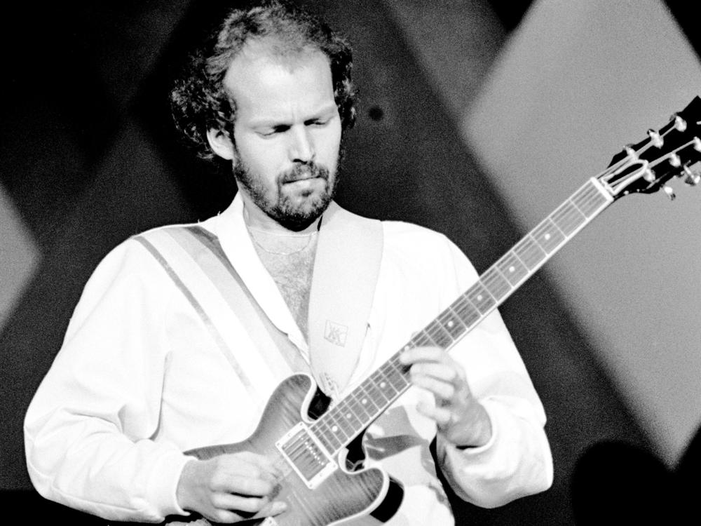 Lasse Wellander performs on stage with ABBA at the Wembley Arena in London in 1979.