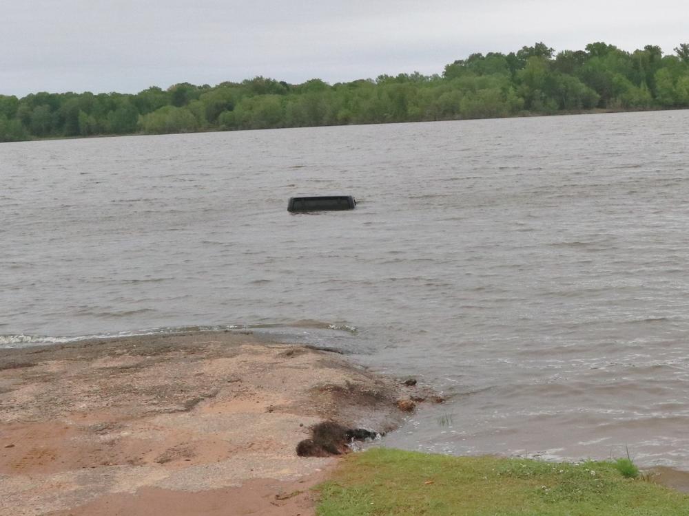This black Jeep was almost entirely submerged in Lake o' the Pines in Marion County, Texas. It wasn't until a tow truck started to pull it from the water that a woman was spotted inside.