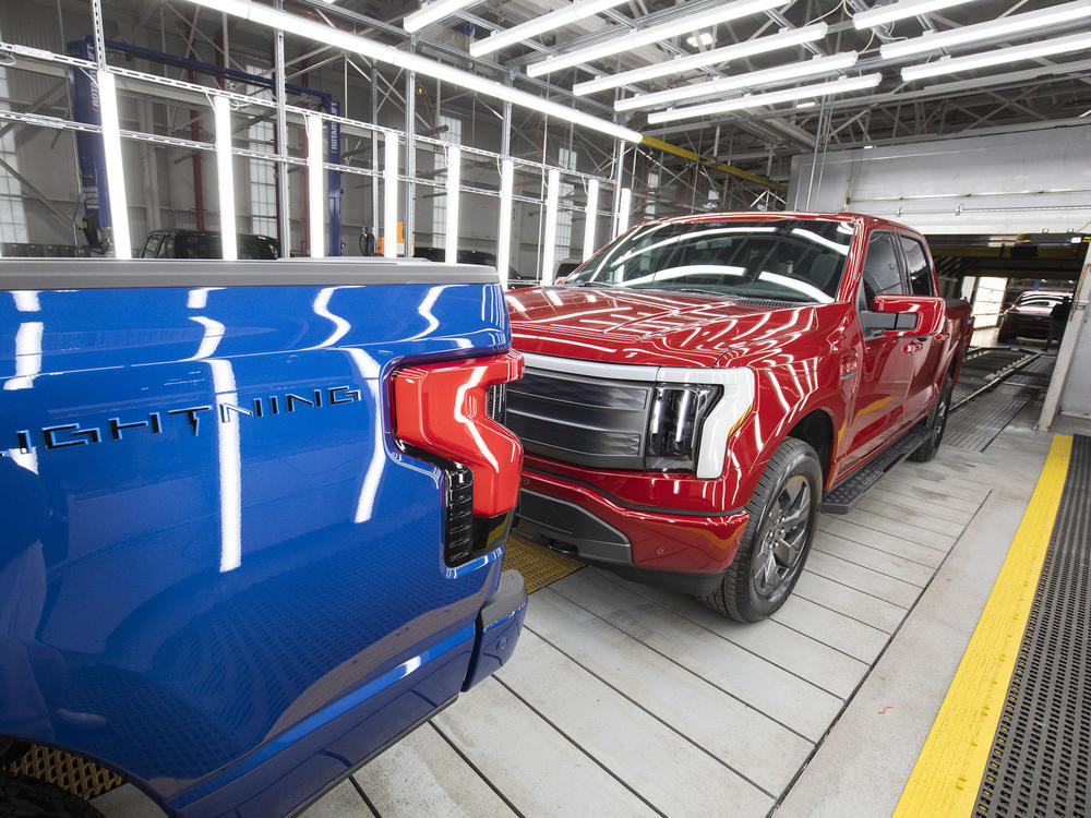 Ford F-150 Lightning pickup trucks are shown at the Ford Rouge Electric Vehicle Center in Dearborn, Michigan, on April 26, 2022. The Lightning will still be eligible for the full $7,500 tax credit, but it also depends on other criteria including the sticker price of the vehicle and the buyer's income.