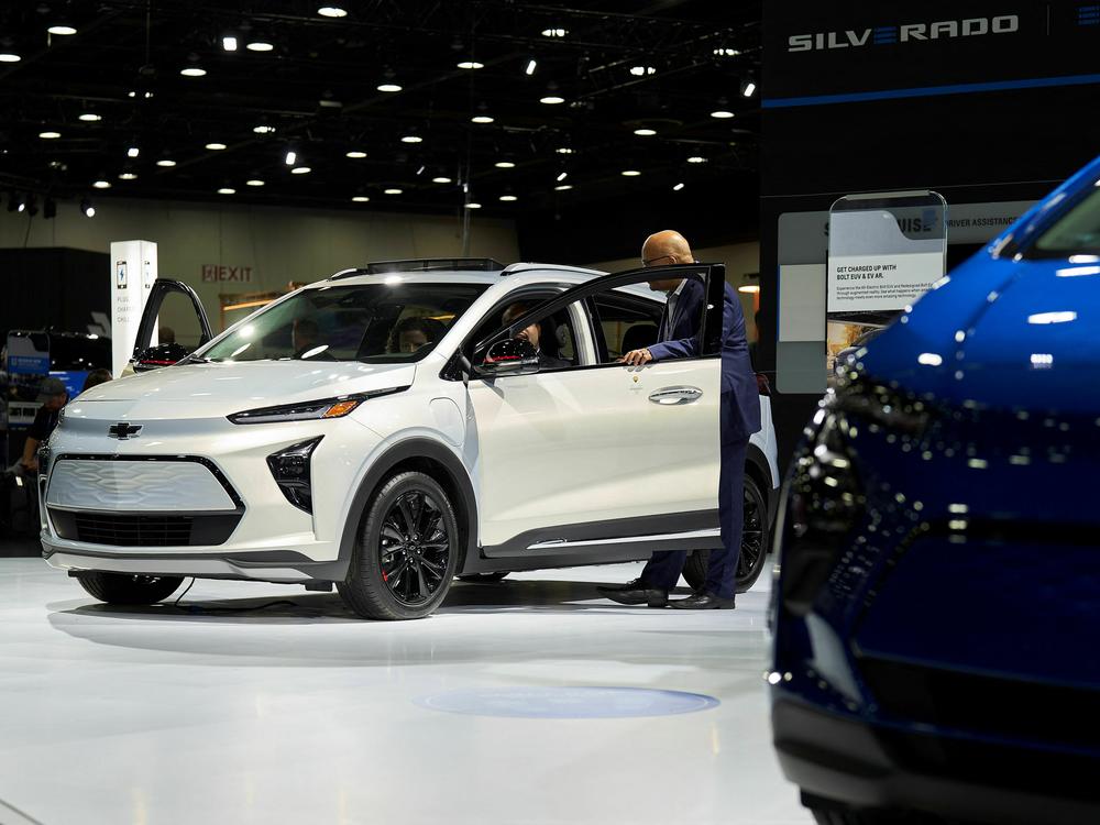 A man looks at a Chevy Bolt EUV at the North American International Auto Show in Detroit on Sept. 14, 2022. The IRS has announced that Chevy Bolts and Bolt EUVs will qualify for the full tax credit.