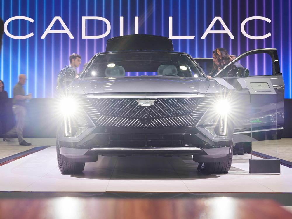 People look at the Cadillac Lyriq at the North American International Auto Show in Detroit on Sept. 14, 2022. The electric car will still qualify for the full tax credit under the latest IRS guidelines.