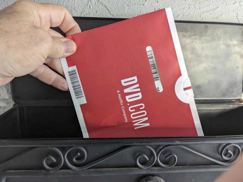 A Netflix DVD envelope is shown in 2022 in San Francisco. Netflix is poised to shut down its DVD-by-mail rental service.