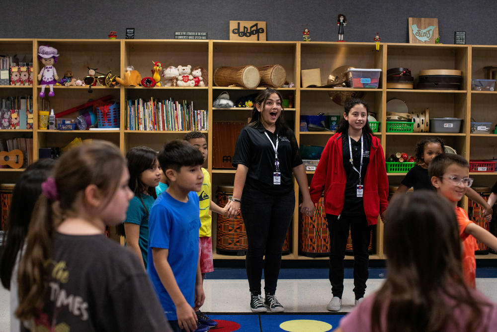 CAST Teach students Isabel Tate and Samantha Lopez, 14, play a game with their Forester Elementary students at the end of music class.