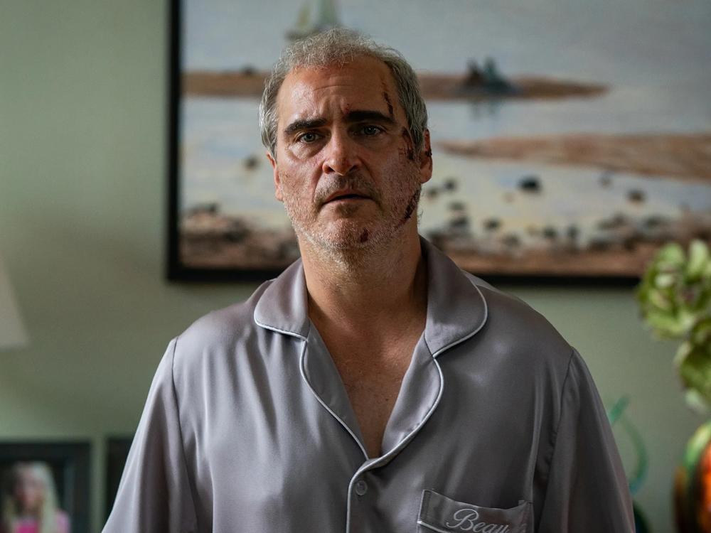 Joaquin Phoenix's character is attacked, tortured, threatened, knocked unconscious and terrorized in Ari Aster's <em>Beau is Afraid.</em>