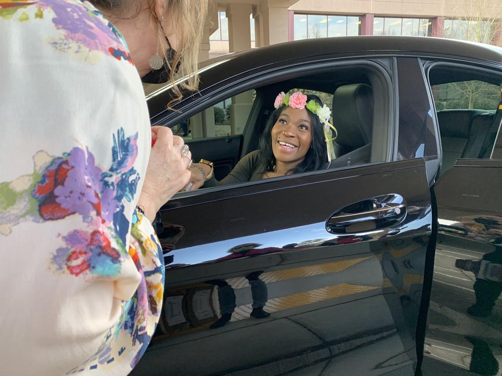 A pregnant military veteran receives a tiara at a 'drive through' baby shower at the VA in Atlanta. Among researchers, there's concern that women veterans may be at <a href=