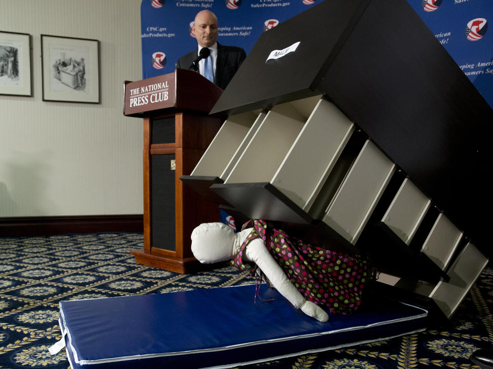 Former Consumer Product Safety Commission chairman Elliot Kaye watches a demonstration of how an Ikea dresser can tip and fall on a child during a news conference at the National Press Club in 2016.