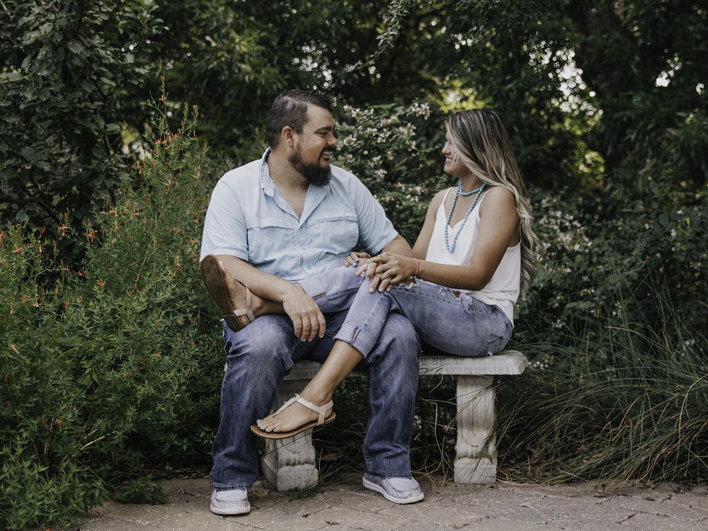 Jaci Statton and her husband, Dustin, in an engagement photo from 2021. Jaci had a partial molar pregnancy and was not treated by emergency rooms in Oklahoma. She traveled to Kansas for an abortion.