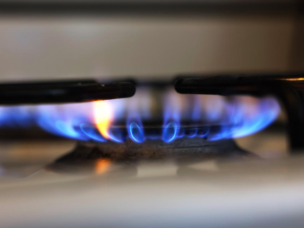 In this photo illustration, a flame burns on a gas stove on April 28, 2023 in New York City.