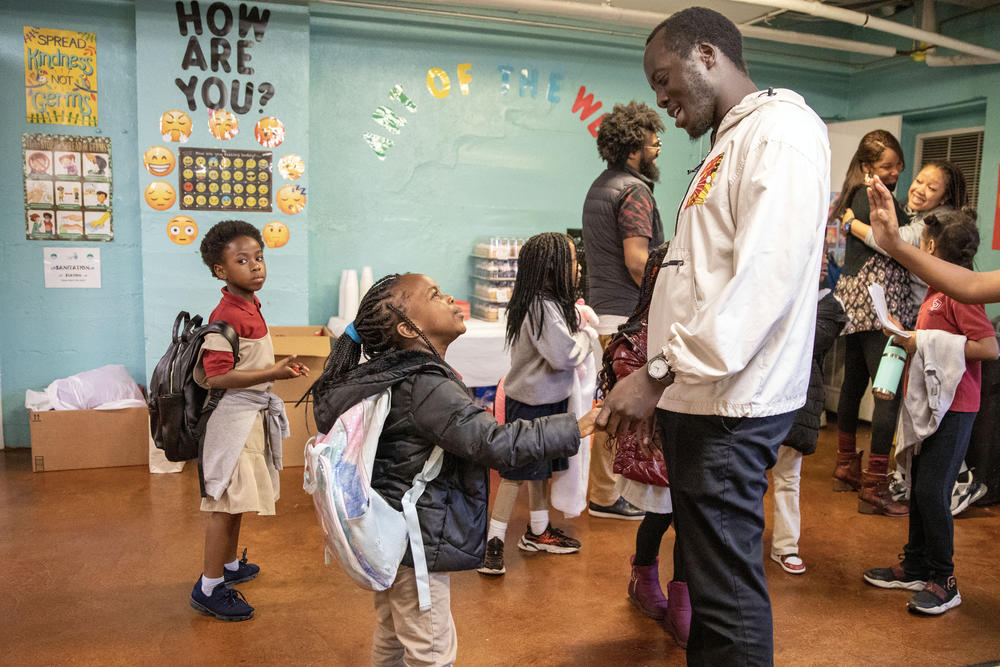 Director of Diversity, Equity and Inclusion Isaac James greets children at the Memphis Refugee Empowerment Program on Feb. 15.