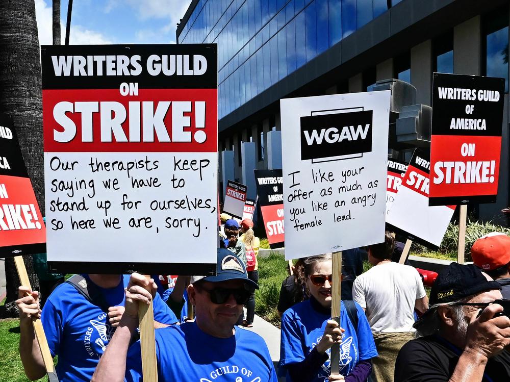 Writers picket in front of Netflix offices in Hollywood on Tuesday as the WGA strike began.