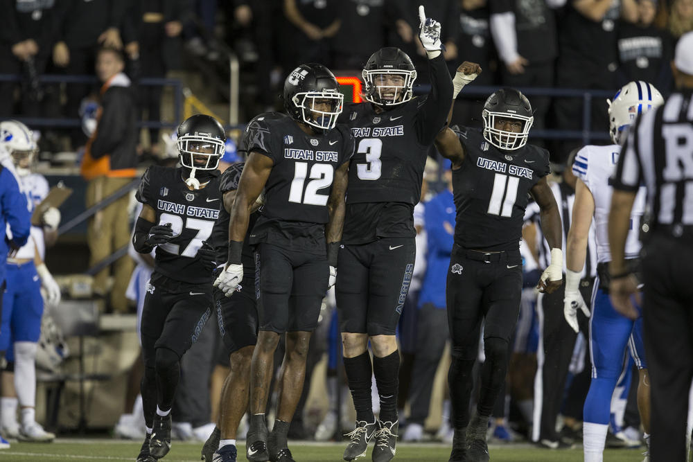 Byron Vaughns (far right) is on the move again, saying goodbye to Utah State.