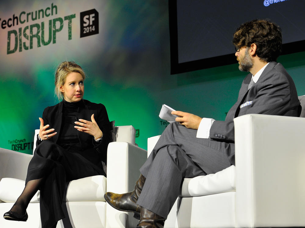 Elizabeth Holmes and TechCrunch Writer and Moderator Jonathan Shieber speak onstage at TechCrunch Disrupt at Pier 48 on September 8, 2014 in San Francisco, California. Holmes impressed the business world with her promises to revolutionize the health care industry