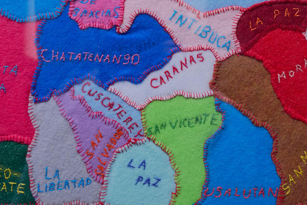 Detail of a sewn art piece that's part of a collection at Capital District Latino space in Albany, N.Y. CDL has a collection of all countries in Latin America and the Caribbean. Staff say people are excited to see their countries represented on the walls.