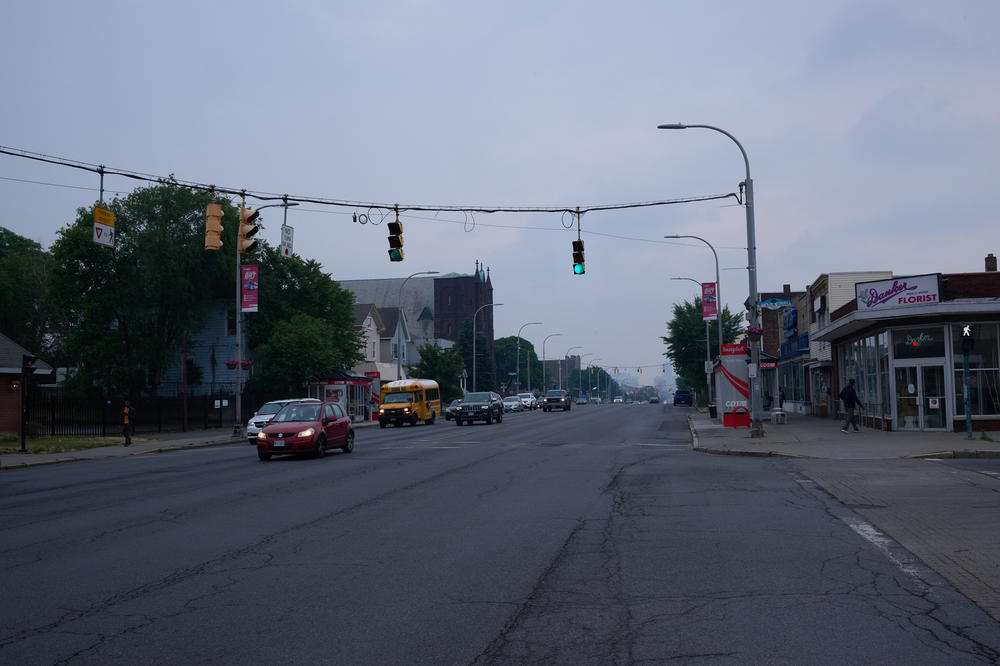 Early morning traffic gets underway at an intersection in Albany, N.Y. Parts of the city offer little public transportation, which is a significant obstacle for residents — including newly arrived migrants.