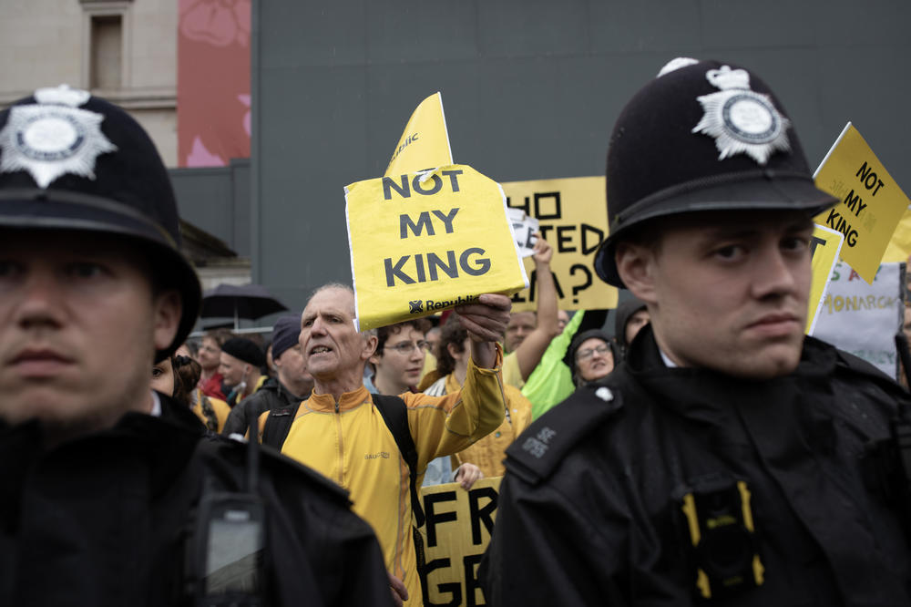 Police stand in front of demonstrators during an anti-monarchy protest at Trafalgar Square during the coronation of Charles III on May 6 in London. The protest was organized by Republic, a group agitating for the monarchy to be replaced with an elected head of state.