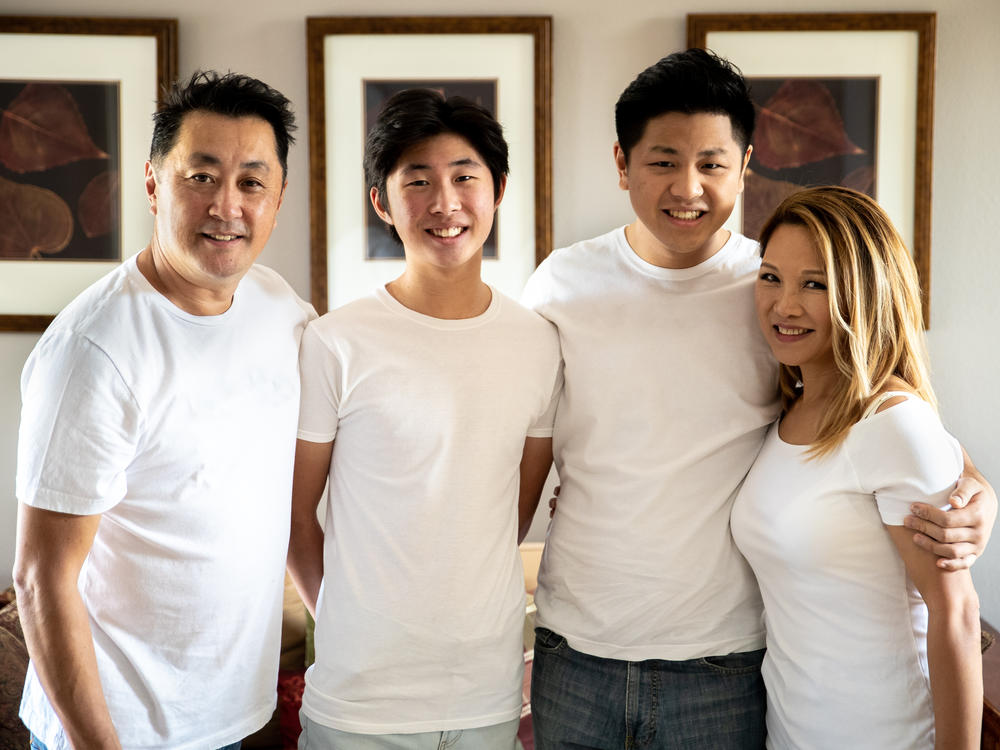 From left, Schwan, Jason, Max and Miki Park in 2020. Max recently set a record time in solving the original Rubik's cube.