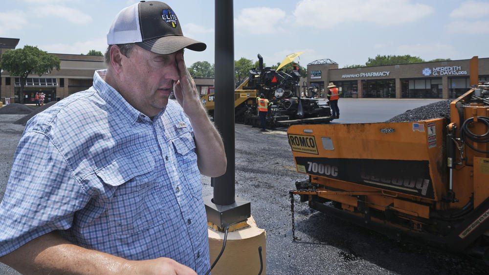 With parts of Texas seeing record heat this week, James Hand spent Tuesday afternoon overseeing an asphalt resurfacing job at a parking lot in Richardson, Texas. The asphalt has a temperature of 250 to 300 degrees when it's applied, Hand said.