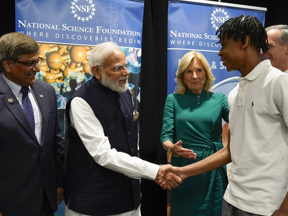 Indian Prime Minister Narendra Modi and first lady Jill Biden greet Noah Isirimah at an event about technology and education in on June 21, part of Modi's state visit.