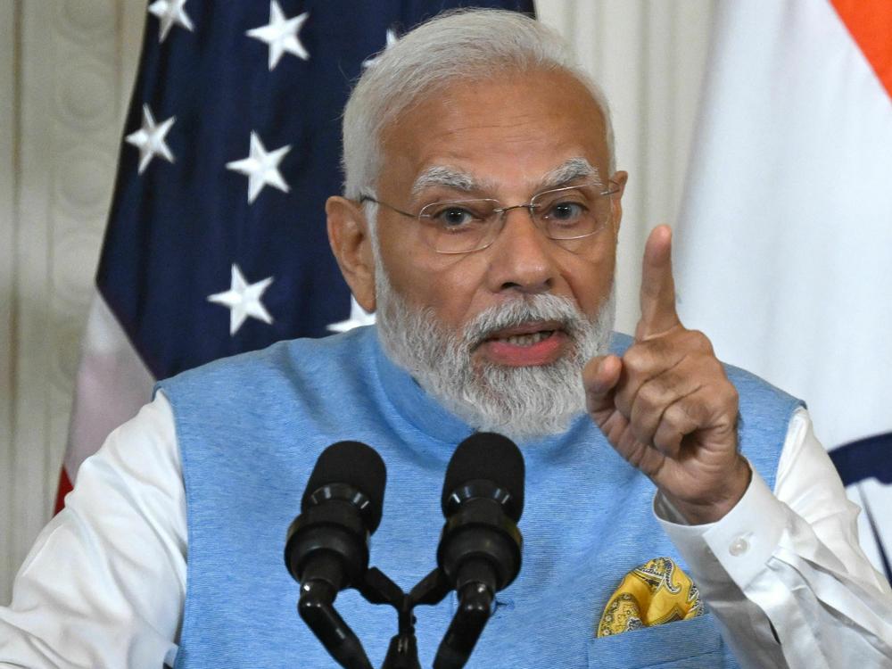 Indian Prime Minister Narendra Modi answers a question during a press conference with President Biden.