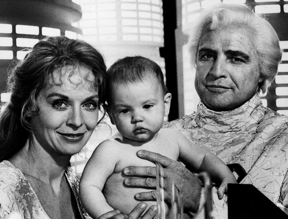 Marlon Brando, right, baby Lee Quigley, and Susannah York in the 1978 <em>Superman.</em>