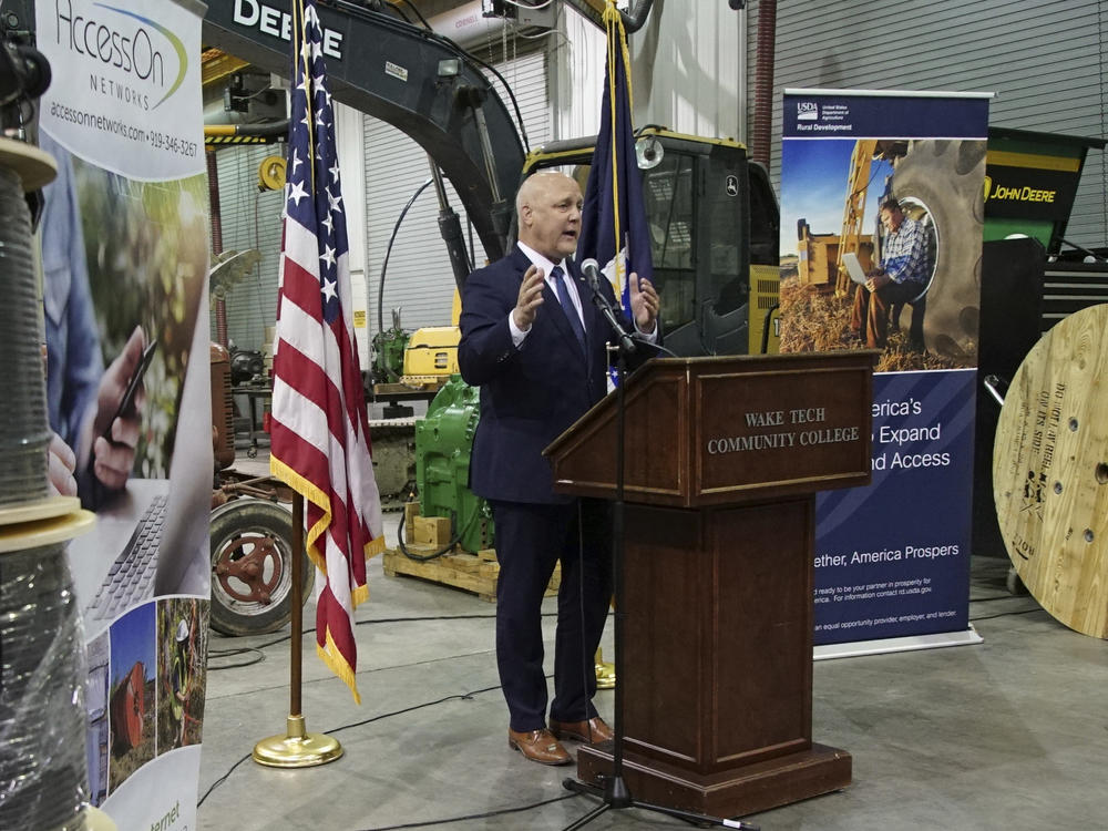 White House senior adviser Mitch Landrieu speaks in a repurposed railroad depot in Elm City, N.C., during an event to announce rural broadband funding in October 2022.