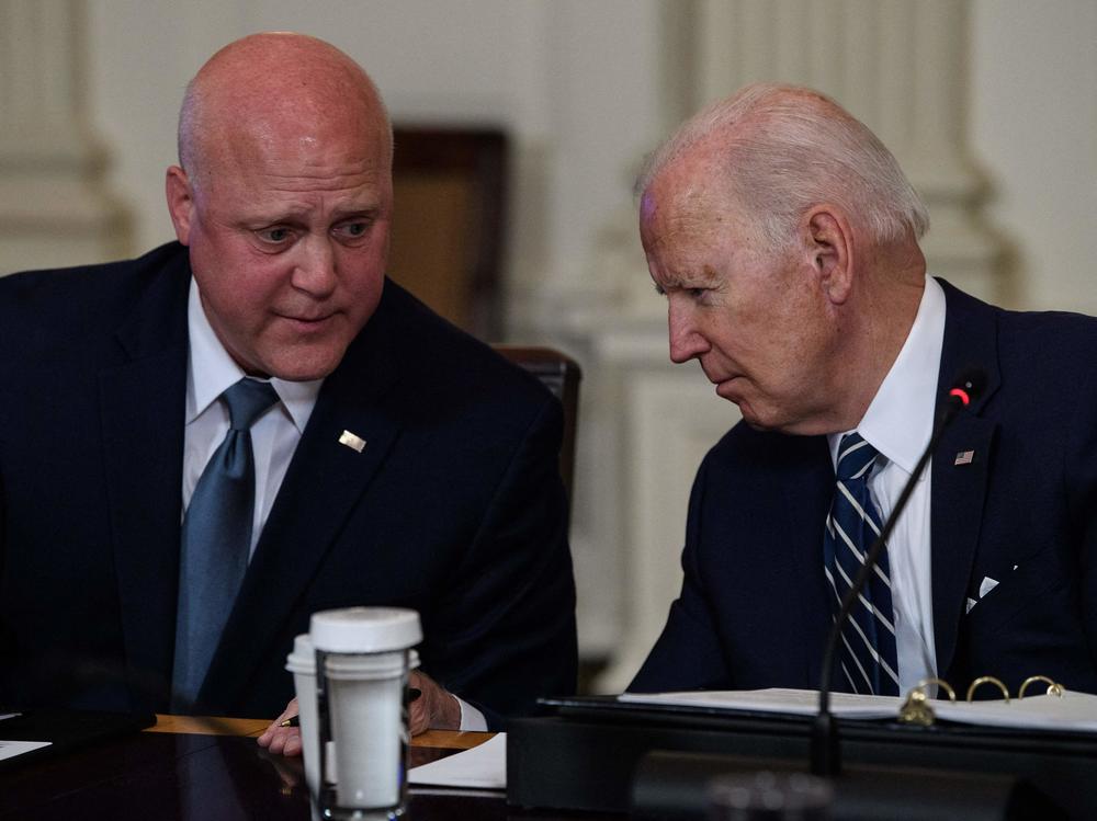 Mitch Landrieu speaks with President Biden at the White House in April 2022.