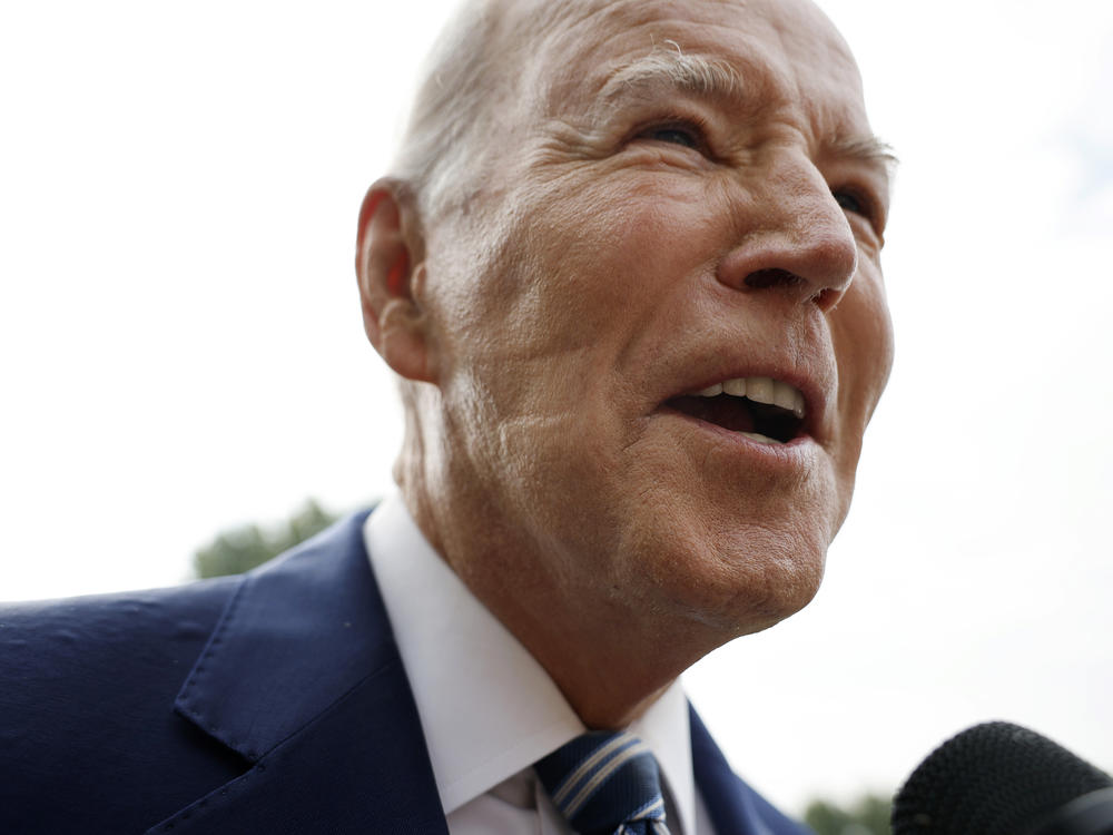 President Biden talks to reporters as he departs the White House on Wednesday. After reporters pointed out the marks on his face, the White House revealed the president used a CPAP machine, used by people who have sleep apnea, Tuesday night.