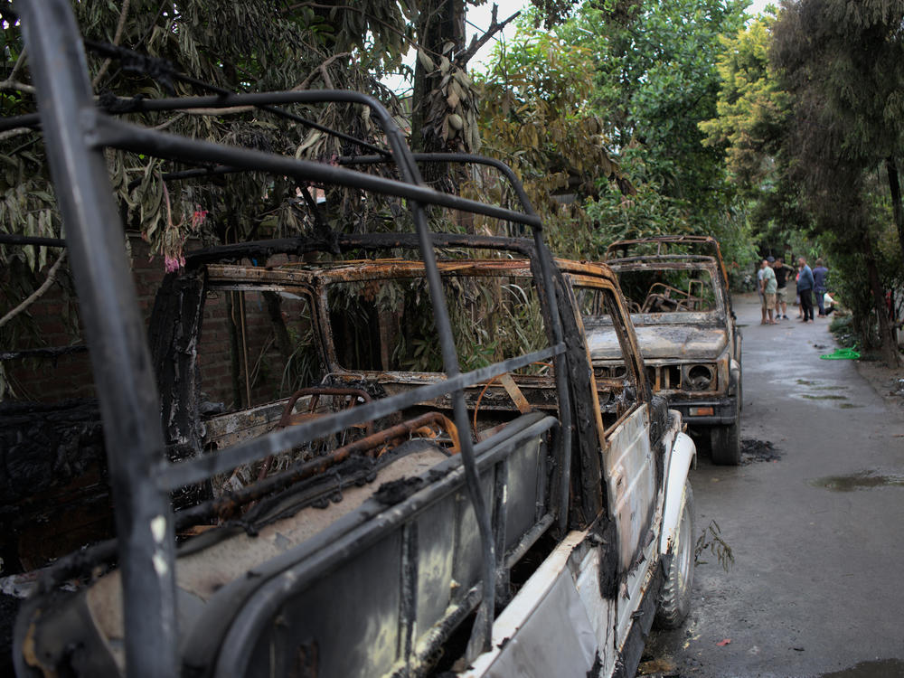 Burned remains of cars, which were torched by an angry mob during an attack in Imphal, Manipur.