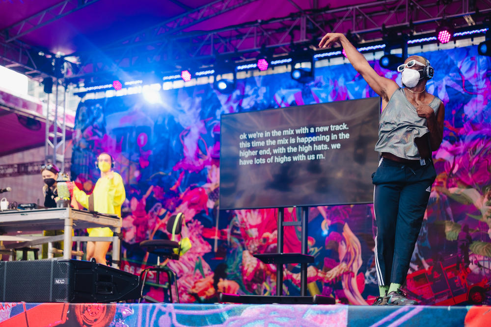 DJs, dancers, spectacular lighting, screens with captioning and an American Sign Language interpreter at the Silent Disco celebrating Disability Pride Month.