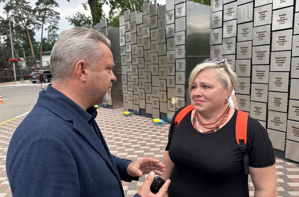 Bucha Mayor Anatolii Fedoruk spoke with residents at the unveiling of a Wall of Honor that featured the names of 501 civilians killed when Russia invaded last year. Some of the plaques are blank because around 80 bodies have still not been positively identified.