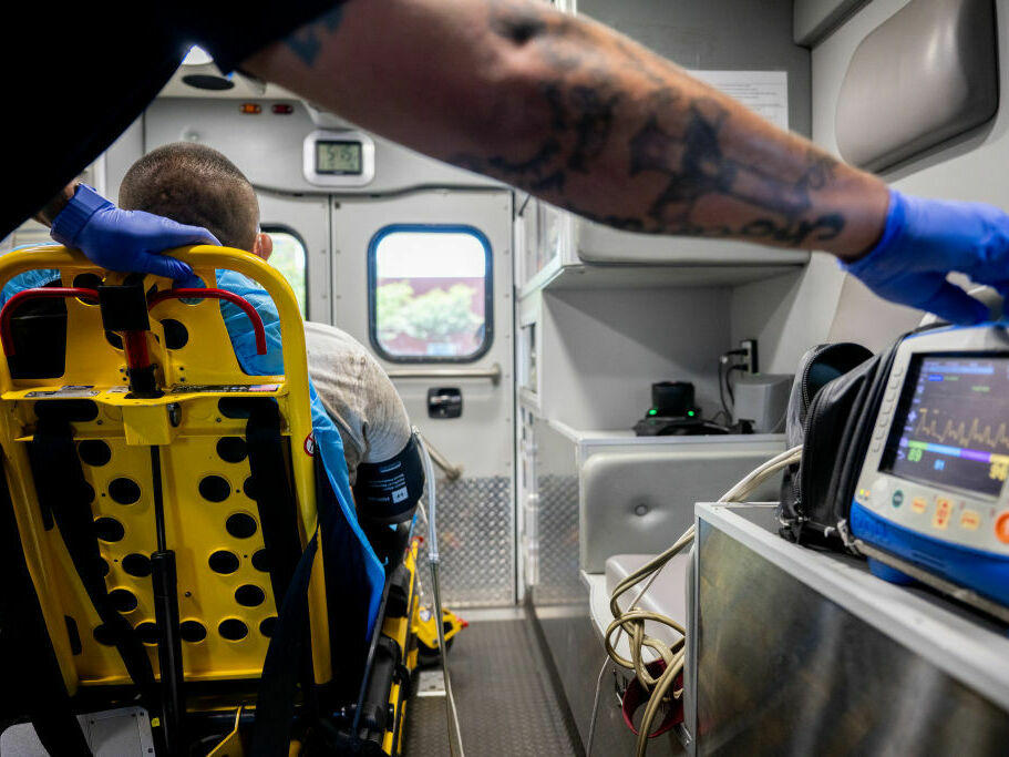Parts of the U.S. have been experiencing heat waves this summer. Here, an EMT tends to a patient who called in with chest pains after working outside for hours in Texas in June.