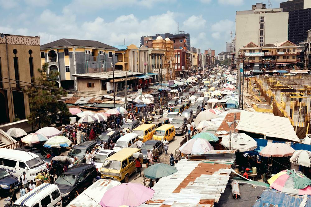 Thousands of vendors do business at Balogun Market in Lagos. The rising cost of fuel has made it harder to do business — and for customers to afford services and goods, let alone public transportation.