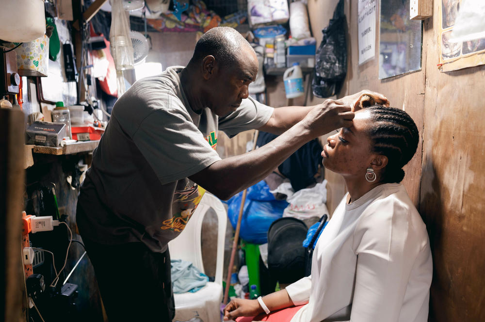 Kehinde Adebajo, a beautician and barber, has been working in Balogun Market, the largest in Lagos, since he was 16. Now 56, he says it's never been tougher to earn a living: 