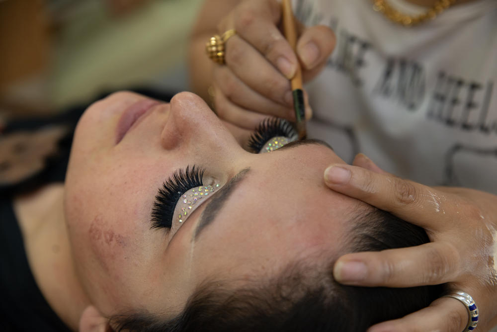A customer at a salon in Kabul on July 8, days after the Taliban ban was announced, effective at the end of the month. Sadiq Akif Mahjer, a spokesman for the ministry, said in a video posted on Twitter that hair weaves and eyebrow plucking are considered distasteful, even forbidden, by many conservative Muslims.